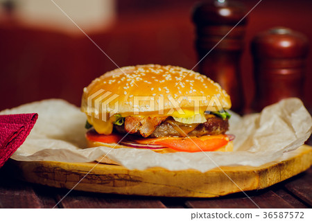 Burger with beef on wooden background with Burger with beef on wooden background with 36587572