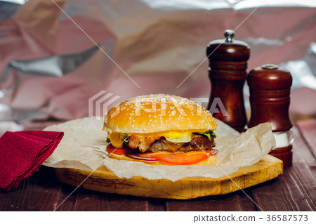 Burger with beef on wooden background with Burger with beef on wooden background with 36587573