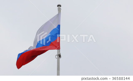 Russian flag on the flagpole waving in the wind Russian flag on the flagpole waving in the wind 36588144