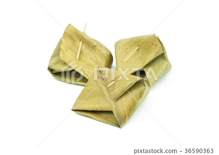 Thai dessert wrapped in banana leaf isolated Thai dessert wrapped in banana leaf isolated 36590363
