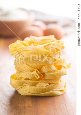 Raw tagliatelle pasta. Raw tagliatelle pasta. 36591593