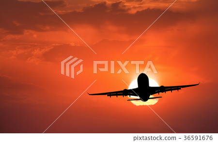 Silhouette of landing aircraft and red sky Silhouette of landing aircraft and red sky 36591676