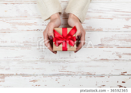 Present box in woman's hands Present box in woman's hands 36592365