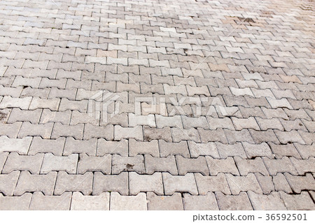 Paving stone on the road as a background Paving stone on the road as a background 36592501
