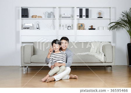 Young father and son take a rest in the living room 117 Young father and son take a rest in the living room 117 36595466
