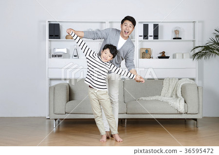 Young father and son take a rest in the living room 147 Young father and son take a rest in the living room 147 36595472