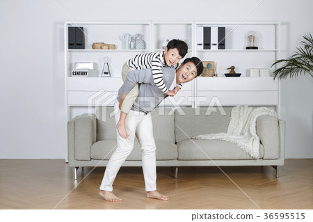 Young father and son take a rest in the living room 135 Young father and son take a rest in the living room 135 36595515