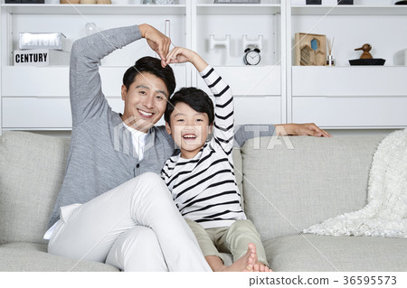 Young father and son take a rest in the living room 162 Young father and son take a rest in the living room 162 36595573