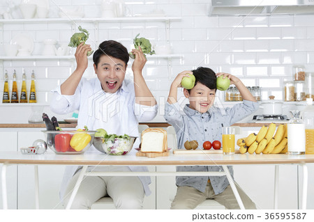 Young father with son preparing dishes, and dish washing together. 339 Young father with son preparing dishes, and dish washing together. 339 36595587