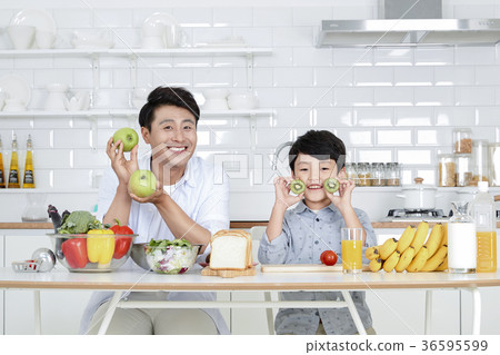 Young father with son preparing dishes, and dish washing together. 340 Young father with son preparing dishes, and dish washing together. 340 36595599