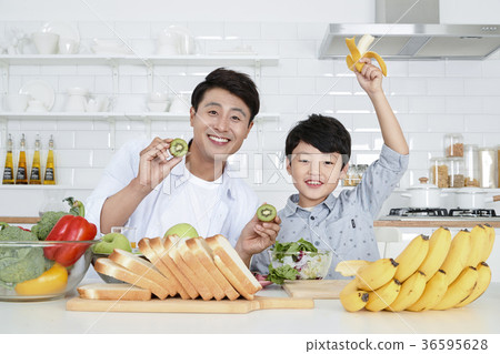 Young father with son preparing dishes, and dish washing together. 348 Young father with son preparing dishes, and dish washing together. 348 36595628