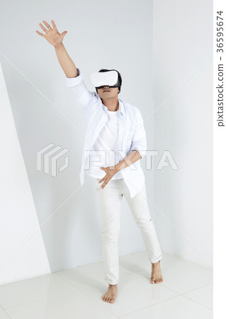 Young father and son playing with a VR game. 326 Young father and son playing with a VR game. 326 36595674