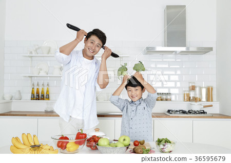 Young father with son preparing dishes, and dish washing together. 338 Young father with son preparing dishes, and dish washing together. 338 36595679