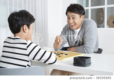 Young father's good teacher for son - playing guitar, reading storybook, etc. 299 Young father's good teacher for son - playing guitar, reading storybook, etc. 299 36595685