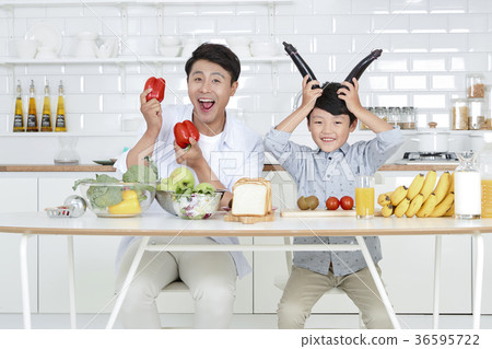 Young father with son preparing dishes, and dish washing together. 349 Young father with son preparing dishes, and dish washing together. 349 36595722