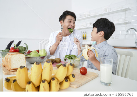 Young father with son preparing dishes, and dish washing together. 352 Young father with son preparing dishes, and dish washing together. 352 36595765