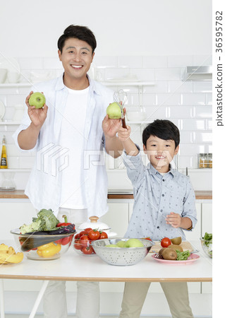 Young father with son preparing dishes, and dish washing together. 353 Young father with son preparing dishes, and dish washing together. 353 36595782