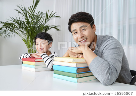 Young father's good teacher for son - playing guitar, reading storybook, etc. 276 Young father's good teacher for son - playing guitar, reading storybook, etc. 276 36595807