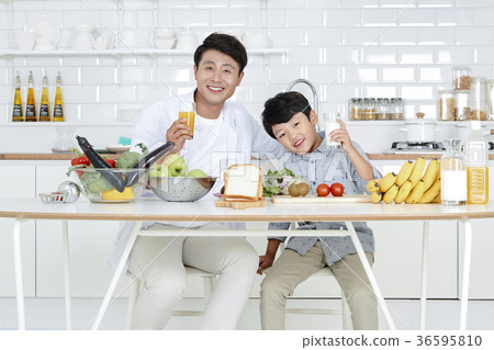 Young father with son preparing dishes, and dish washing together. 358 Young father with son preparing dishes, and dish washing together. 358 36595810