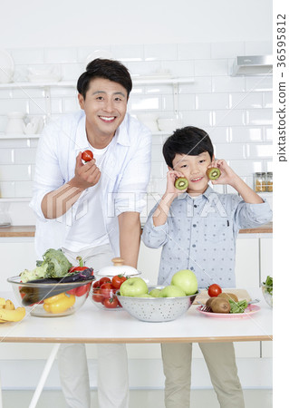 Young father with son preparing dishes, and dish washing together. 364 Young father with son preparing dishes, and dish washing together. 364 36595812