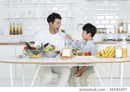 Young father with son preparing dishes, and dish washing together. 355 Young father with son preparing dishes, and dish washing together. 355 36595887