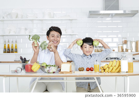 Young father with son preparing dishes, and dish washing together. 357 Young father with son preparing dishes, and dish washing together. 357 36595900