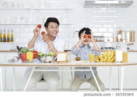 Young father with son preparing dishes, and dish washing together. 359 Young father with son preparing dishes, and dish washing together. 359 36595904