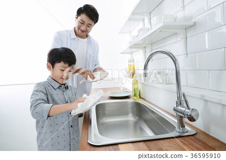 Young father with son preparing dishes, and dish washing together. 333 Young father with son preparing dishes, and dish washing together. 333 36595910