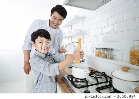 Young father with son preparing dishes, and dish washing together. 336 Young father with son preparing dishes, and dish washing together. 336 36595984