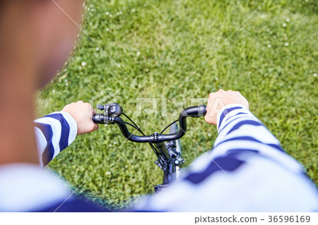Young guy take a relax in park, sit on green grass and walking in around. 134 Young guy take a relax in park, sit on green grass and walking in around. 134 36596169