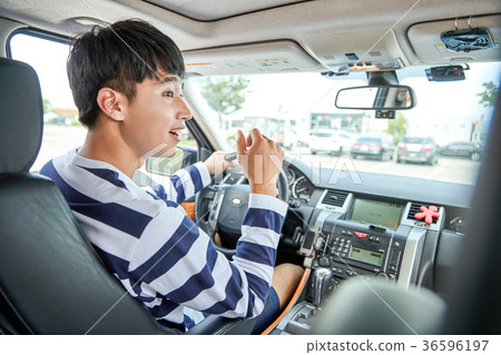 Young guy sit in his car, and on trunk. 139 36596197