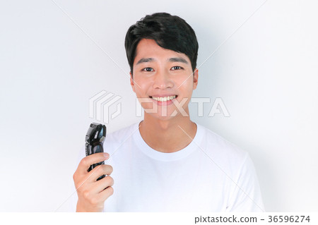 A mugshot of Young guy.- shaving, put lotion, hair dryer, etc. 204 A mugshot of Young guy.- shaving, put lotion, hair dryer, etc. 204 36596274