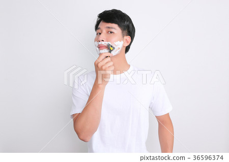 A mugshot of Young guy.- shaving, put lotion, hair dryer, etc. 251 A mugshot of Young guy.- shaving, put lotion, hair dryer, etc. 251 36596374