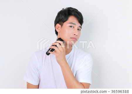 A mugshot of Young guy.- shaving, put lotion, hair dryer, etc. 219 A mugshot of Young guy.- shaving, put lotion, hair dryer, etc. 219 36596388