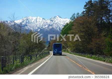 A sightseeing bus that travels towards the Yubari mountain area A sightseeing bus that travels towards the Yubari mountain area 36598828