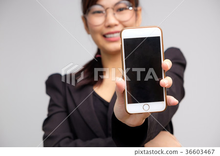 Business asian glasses women use cellphone Business asian glasses women use cellphone 36603467