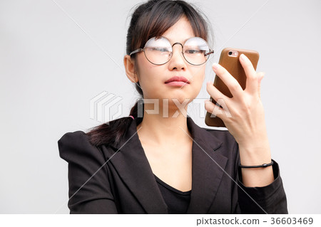 Business asian glasses women use cellphone Business asian glasses women use cellphone 36603469