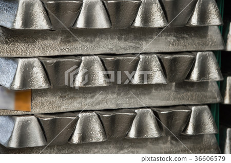 Stack of raw aluminum ingots in aluminum profiles Stack of raw aluminum ingots in aluminum profiles 36606579