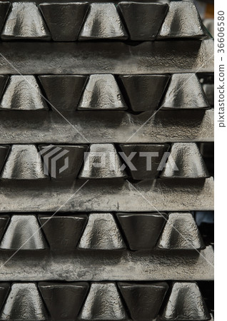 Stack of raw aluminum ingots in aluminum profiles 36606580