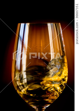 Tasting a glass of sauternes wine Tasting a glass of sauternes wine 36607351
