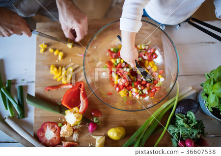 Young father with a toddler boy cooking. Young father with a toddler boy cooking. 36607538