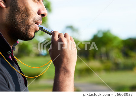 Soccer Referee Focused on Work 36608082