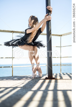 Ballerina posing outdoors 36608254
