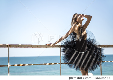 Ballerina posing outdoors Ballerina posing outdoors 36608347