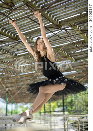Ballerina posing outdoors Ballerina posing outdoors 36608387