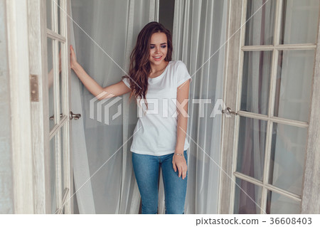 Sexy woman in a white t-shirt. Mock up. Sexy woman in a white t-shirt. Mock up. 36608403
