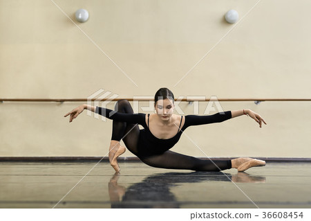 Ballerina posing in dance hall Ballerina posing in dance hall 36608454