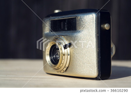 Old vintage golden Penti I camera on wood 36610290