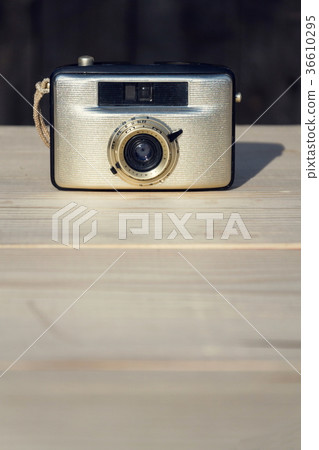 Old vintage golden Penti I camera on wood 36610295