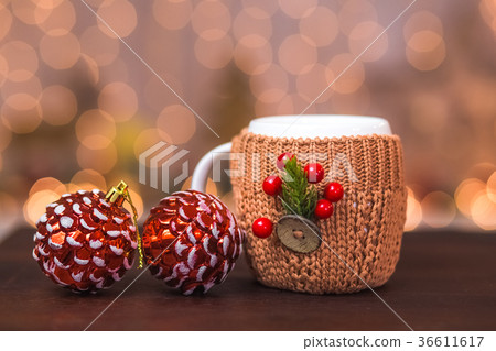 White winter cup in brown knitted sweater White winter cup in brown knitted sweater 36611617